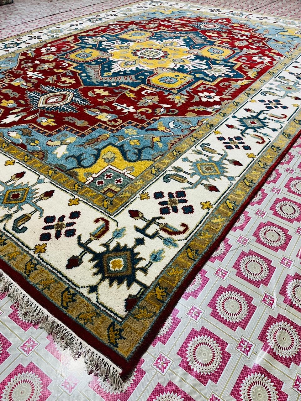 Aurelia red and blue wool rug in a luxury drawing room
