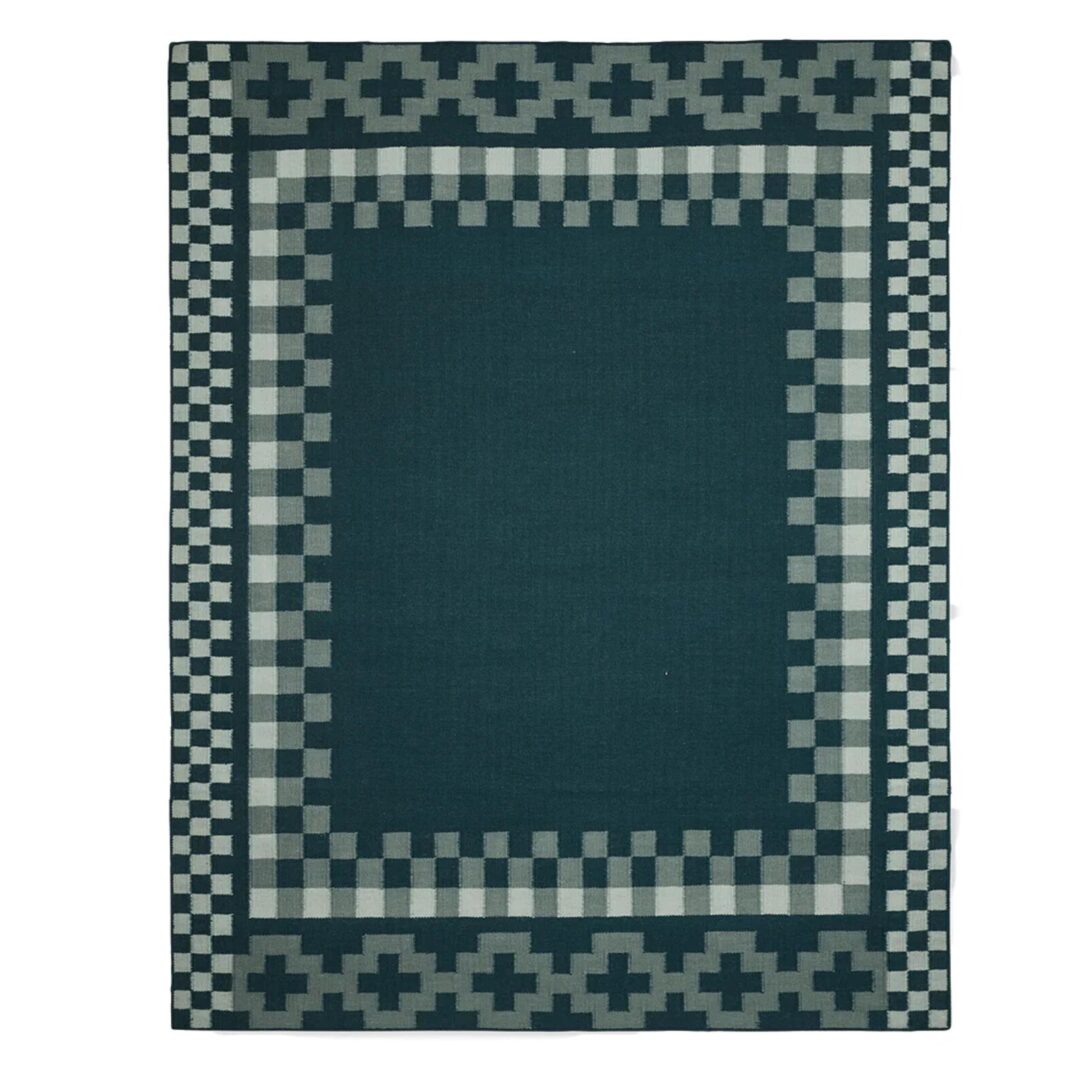 Aster Handwoven Flatweave Wool Rug featuring a Scandinavian geometric border in deep blue, grey, and ivory.