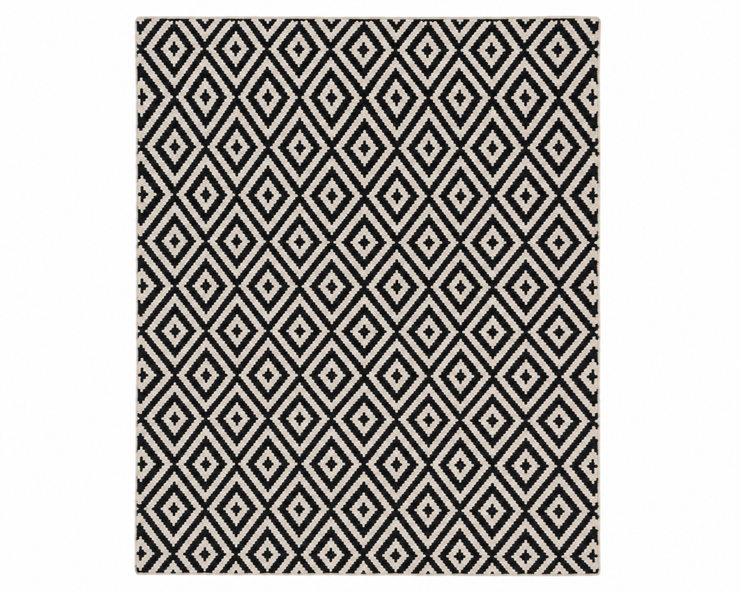 Kairo handwoven flatweave wool rug featuring a black and ivory diamond geometric pattern, handcrafted from premium Afghan wool for Scandinavian and modern interiors.