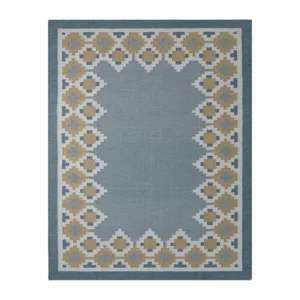 Nordis handwoven flatweave wool rug featuring a Scandinavian geometric border in blue, mustard, beige, and ivory, handmade for modern living rooms, bedrooms, and Nordic interiors.