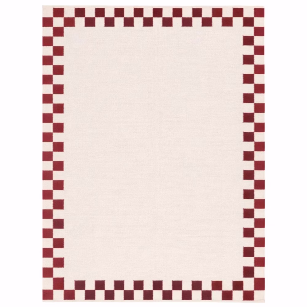 Verra handwoven cotton area rug featuring a cream base with a red checker border in a flatweave design for Scandinavian, farmhouse, and modern interiors.