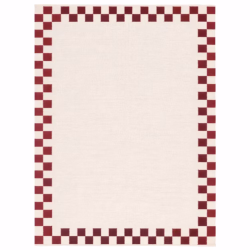 Verra handwoven cotton area rug featuring a cream base with a red checker border in a flatweave design for Scandinavian, farmhouse, and modern interiors.