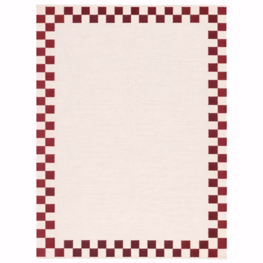 Verra handwoven cotton area rug featuring a cream base with a red checker border in a flatweave design for Scandinavian, farmhouse, and modern interiors.